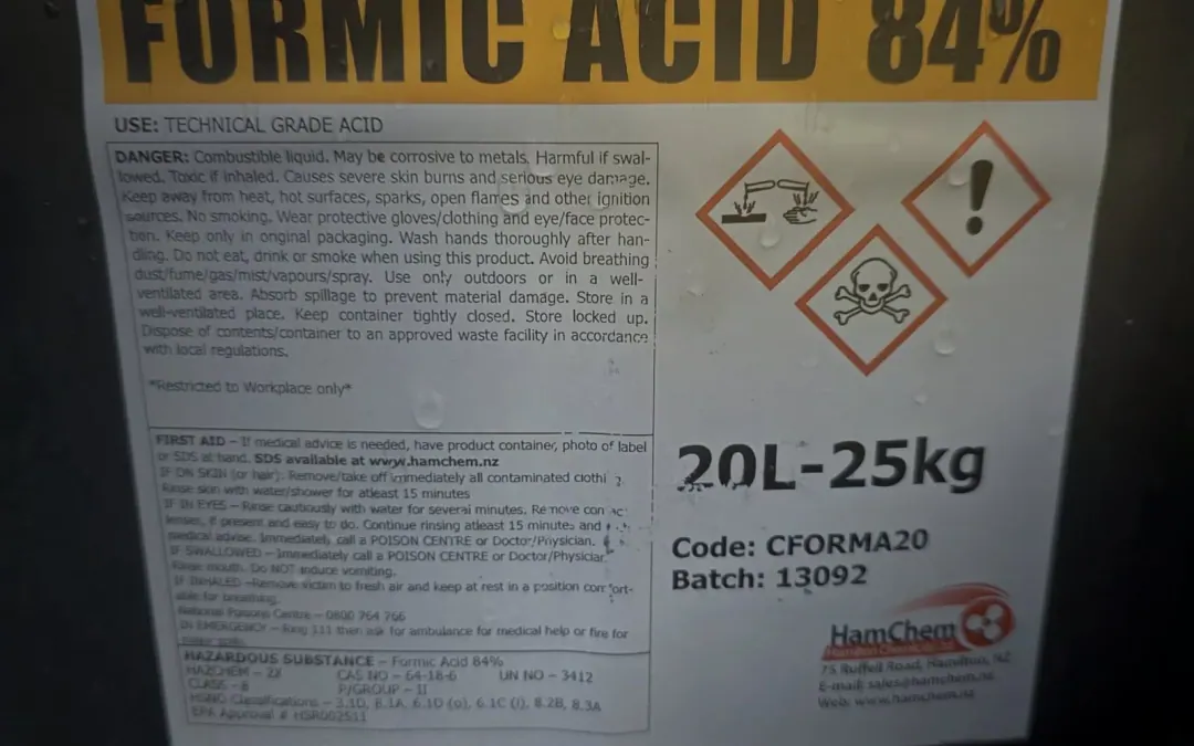 Formic acid 84 percent stock container and hazard label