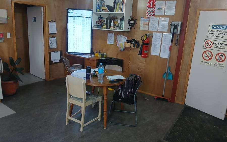 Live BuzzTech dashboard mounted vertically in the real Forest and Bees staff room